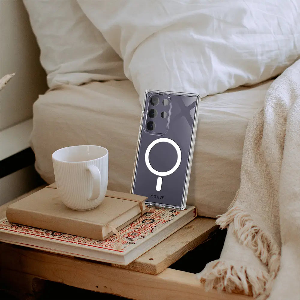 Sleek Galaxy S24 Ultra in a clear case with a magnetic ring, resting on a nightstand. The image highlights the case's minimalist design and compatibility with MagSafe accessories. #GalaxyS24Ultra #ClearCase #MagSafe #MinimalistDesign