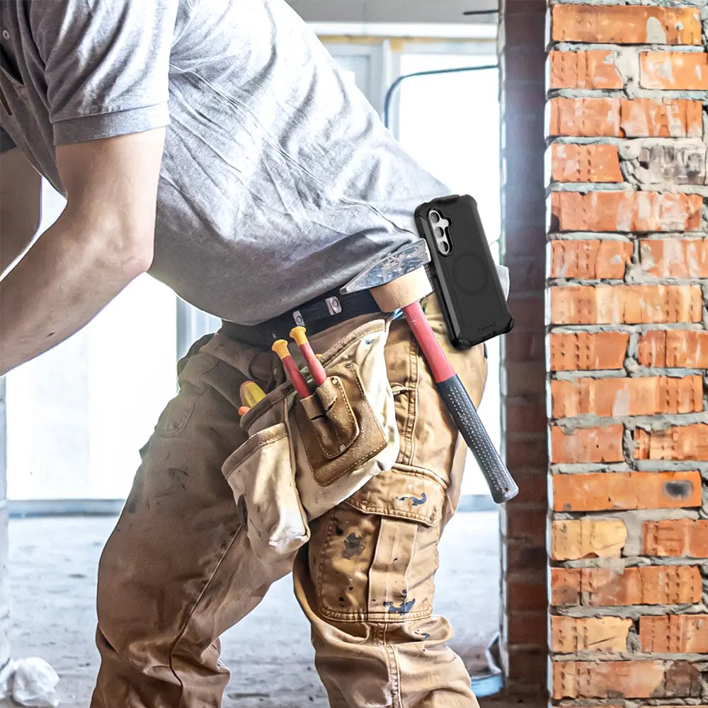 Worker wearing a Galaxy S24 heavy duty case and holster on a tool belt.