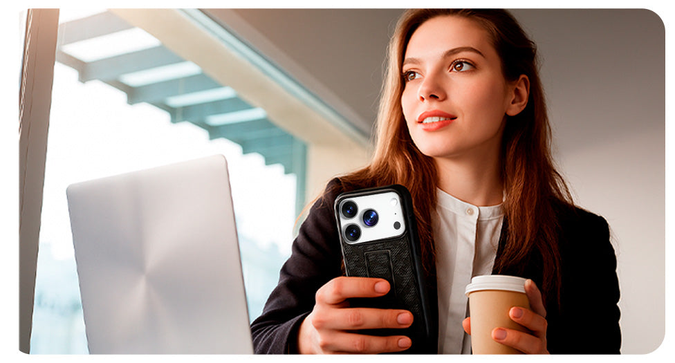 A professional woman in a modern office holding an iPhone 17 with the slim and elegant Motivecase Ranger V1 case.