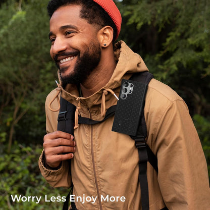 Outdoor lifestyle photo of hiker wearing Motivecase Ranger V1 case for Samsung Galaxy S23 Ultra on backpack strap during mountain adventure.